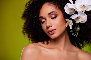 Photo of chic stunning girl with flower curls enjoying freshness in lotion essence extract over...