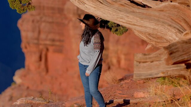 Cowgirl at the Grand Canyon experiences a feeling of pure freedom - travel photography