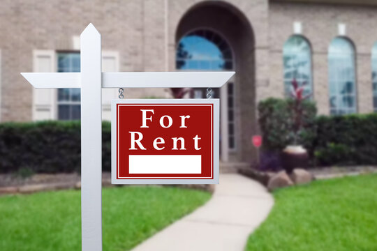 Home for rent. Sign in front of new home.