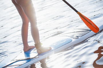 Woman standup paddleboarding