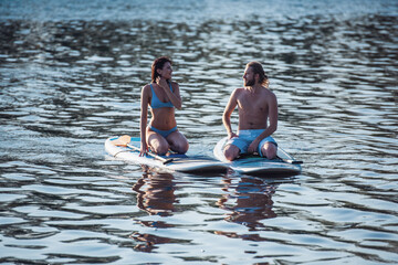 Couple standup paddleboarding