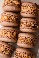 Close-up photo of brown macaroons decorated with cornflakes