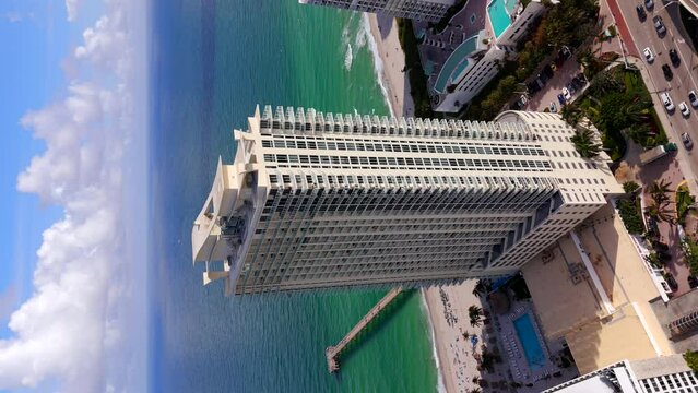 La Perla Sunny Isles Beach. Vertical aerial drone stock video clip 2023
