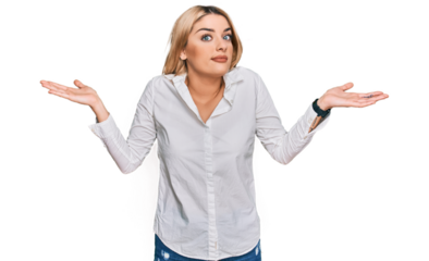 Young caucasian woman wearing casual clothes clueless and confused expression with arms and hands raised. doubt concept.