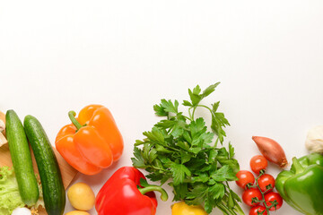 Different fresh vegetables and parsley on white background