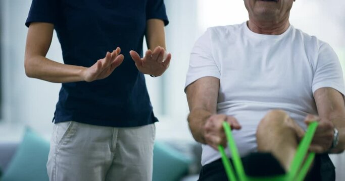 Physiotherapist, resistance band and old man stretching legs, healing osteoporosis or injury assessment for client rehabilitation. Physiotherapy, support and physical therapist helping senior patient