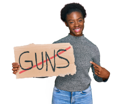 Young african american girl holding no guns warning banner smiling happy pointing with hand and finger