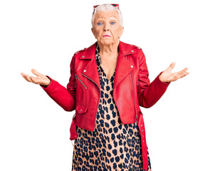 Senior beautiful woman with blue eyes and grey hair wearing a modern style with a red leather...