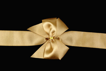 gold bow on black background