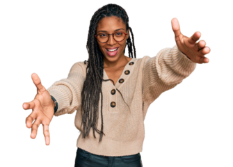 African american woman wearing casual clothes looking at the camera smiling with open arms for hug. cheerful expression embracing happiness.