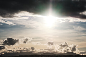 Mountain landscape, sun with cloudy view