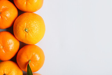 Many sweet mandarins on white background