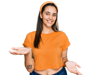 Young hispanic woman wearing casual clothes smiling cheerful with open arms as friendly welcome, positive and confident greetings
