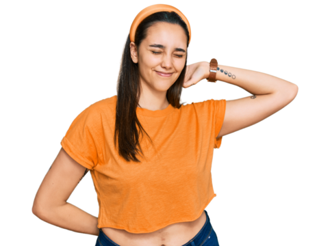 Young hispanic woman wearing casual clothes stretching back, tired and relaxed, sleepy and yawning for early morning