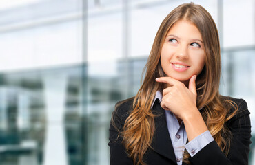 Thoughtful businesswoman in office environment