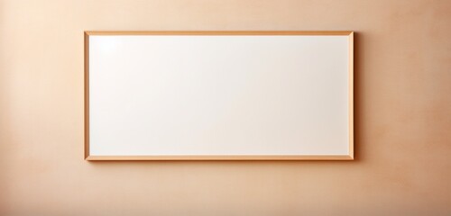 Empty wooden frame on a beige wall, providing a blank canvas for creative exploration.