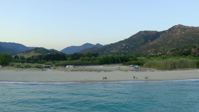 Drone aerial view of Solanas beach with turquoise water and mountain landscape in Sardinia, Italy