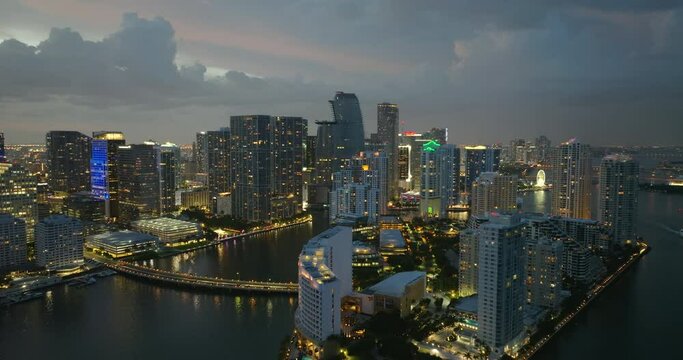 Aerial view of downtown office district of Miami Brickell in Florida, USA at night. High waterfront commercial and residential skyscraper buildings in modern American megapolis