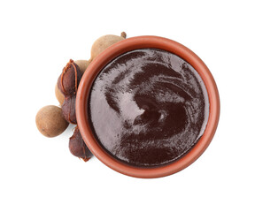 Bowl of tamarind sauce and fresh pods isolated on white, top view