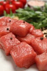 Cooking delicious goulash. Raw beef meat with spices on table, closeup