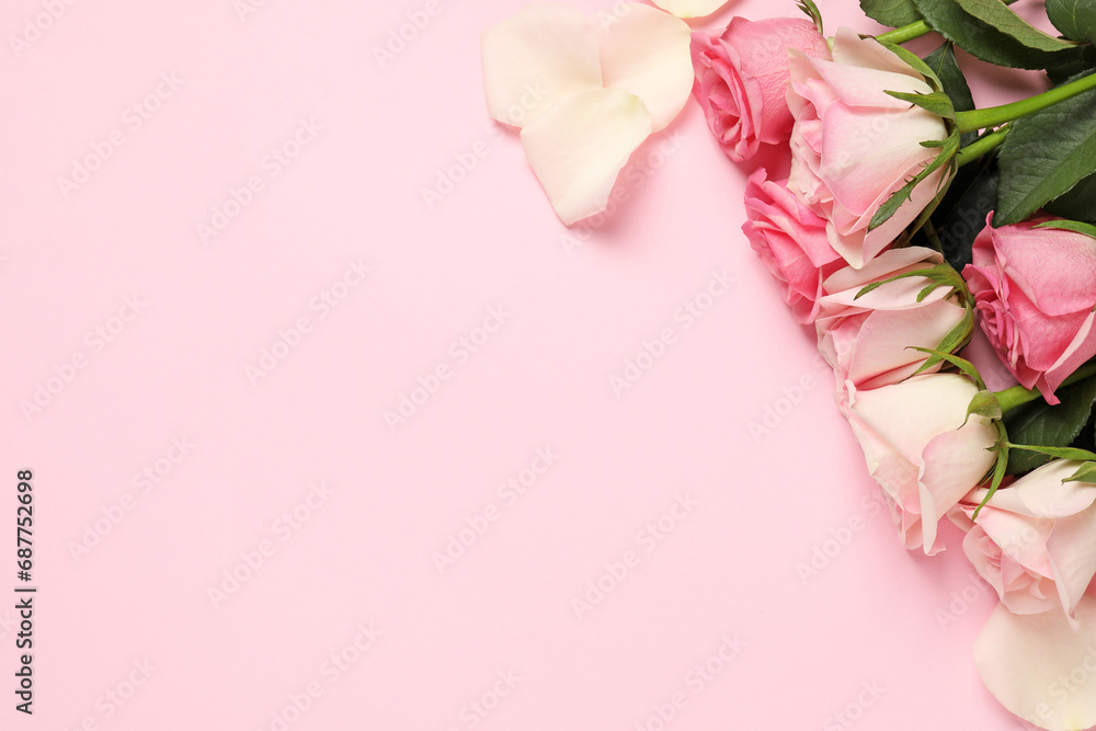 Canvas Prints Beautiful roses and petals on pink background, top view. Space for text