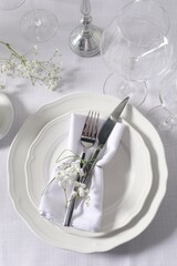 Beautiful table setting with floral decor, flat lay