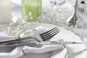 Beautiful table setting with floral decor, closeup