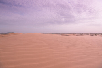 Fototapeta na wymiar Close up on the curves of sand hills in Ba Dan Ji Lin desert of Inner Mongolia