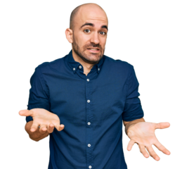 Young hispanic man wearing casual clothes smiling cheerful with open arms as friendly welcome, positive and confident greetings