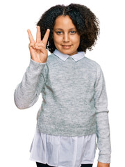 Young little girl with afro hair wearing casual clothes showing and pointing up with fingers number three while smiling confident and happy.