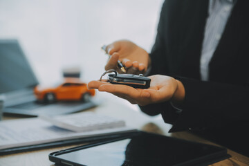 Salesman send key to customer after good deal agreement, successful car loan contract buying or selling new vehicle.