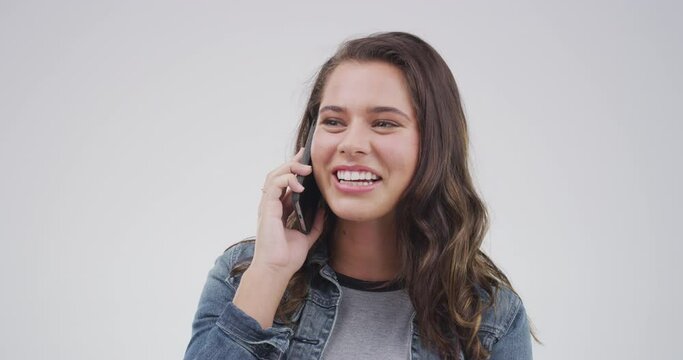 Woman, laugh and phone call in studio for communication, conversation or contact of funny news on white background. Smartphone, speaking and mobile chat for joke, social networking or hello to gossip