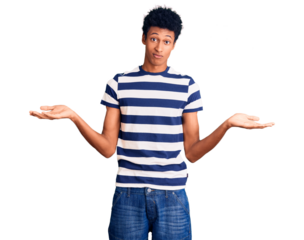 Young african american man wearing casual clothes clueless and confused expression with arms and hands raised. doubt concept.