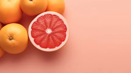 Foto op Plexiglas A grapefruit is cut in half and has a pink center. © Derby