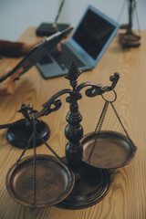 Lawyer, legal advisor, businessman brainstorming information on agreement details Business contracts in legal processing books for accuracy in contract documents. joint financial investment.