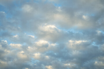 Blue sky with white fluffy cumulus clouds