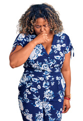 Young african american plus size woman wearing casual clothes feeling unwell and coughing as symptom for cold or bronchitis. health care concept.