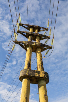Power tower and high voltage wires  with a cloudy sky behind
