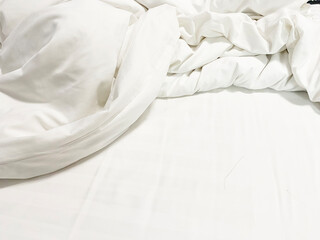 Fototapeta na wymiar White Pillow On Bed And With Wrinkle Messy Blanket In Bedroom, From Sleeping In A Long Night Winter