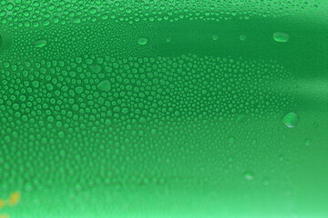 water drop on green beverage cans background, texture of cold aluminium drink package