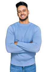 Young arab man wearing casual clothes happy face smiling with crossed arms looking at the camera....