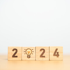 2024 block with lightbulb. Business Idea, Creative, Thinking, brainstorm, Goal, Resolution,...