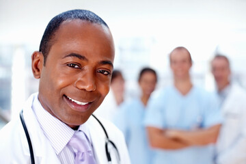 Doctor, black man and portrait of about us with medical, healthcare and clinic staff in a hospital....