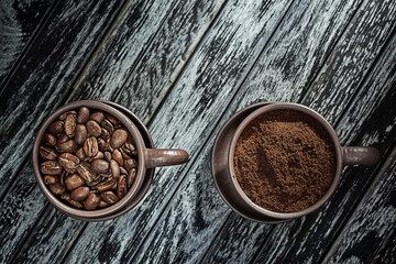 Coffee Ground And Coffeebeans In Cups On Vintage Wood Background.