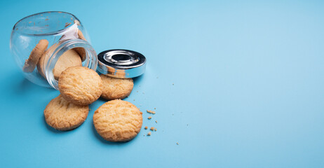 Jar of  cookie on blue background,Space for text and content - 687808244