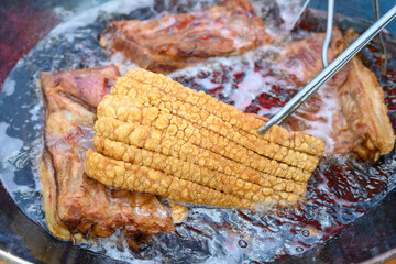 Frying crispy pork requires high heat and a lot of oil.