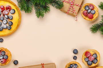 Fototapeta na wymiar Festive delight: Christmas cupcakes adorned with berries