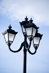 Fototapeta na wymiar City lighting lamps on the street during the daytime