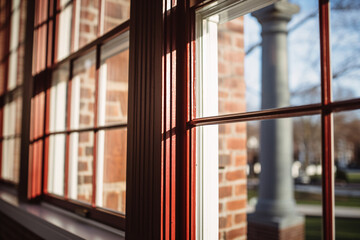 Use a mid-range lens to focus on a single window in a historical building, highlighting its intricate details.