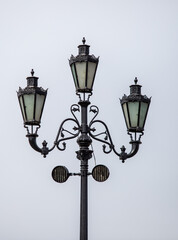 Fototapeta na wymiar City lighting lamps on the street during the daytime